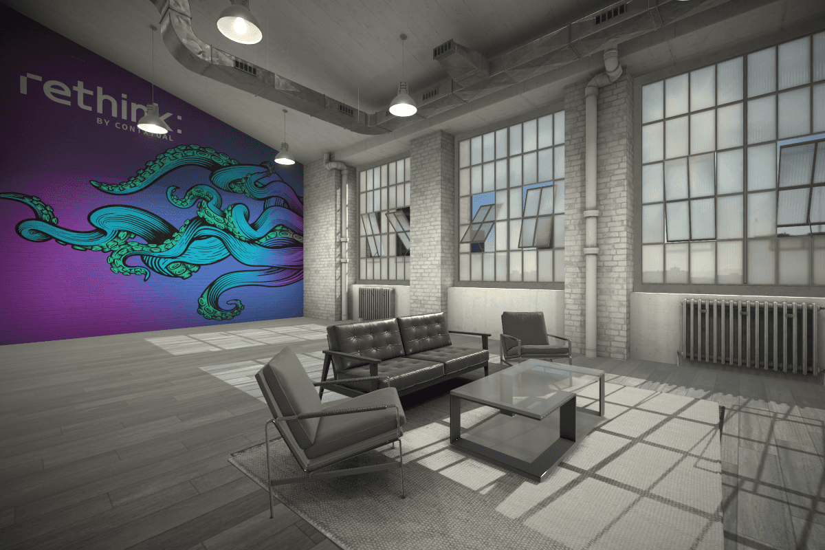 A branded reTHINK lounge with a mural wall used to host clients