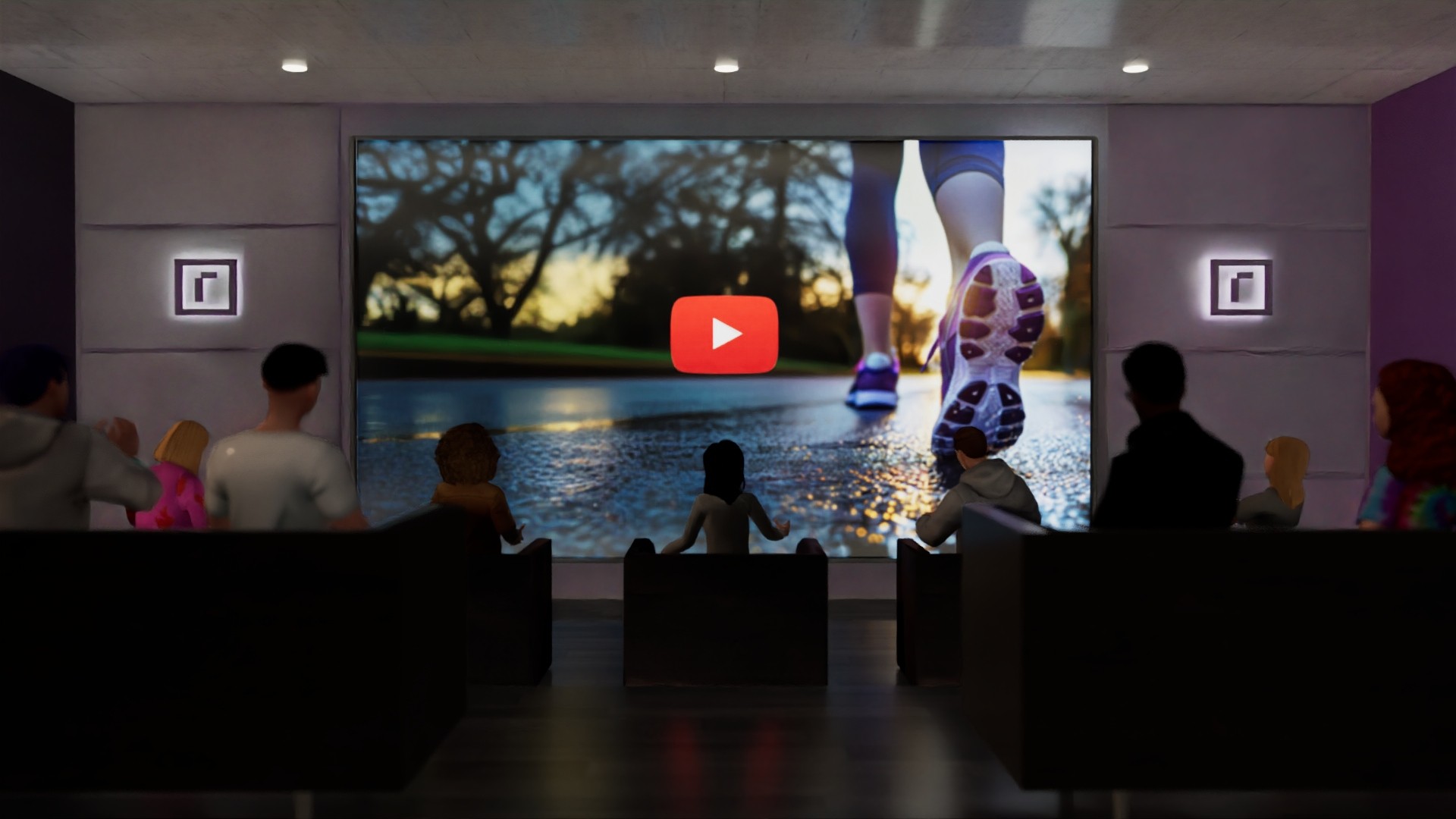 An audience seated in a reTHINK screening room watching video on a wall-sized screen